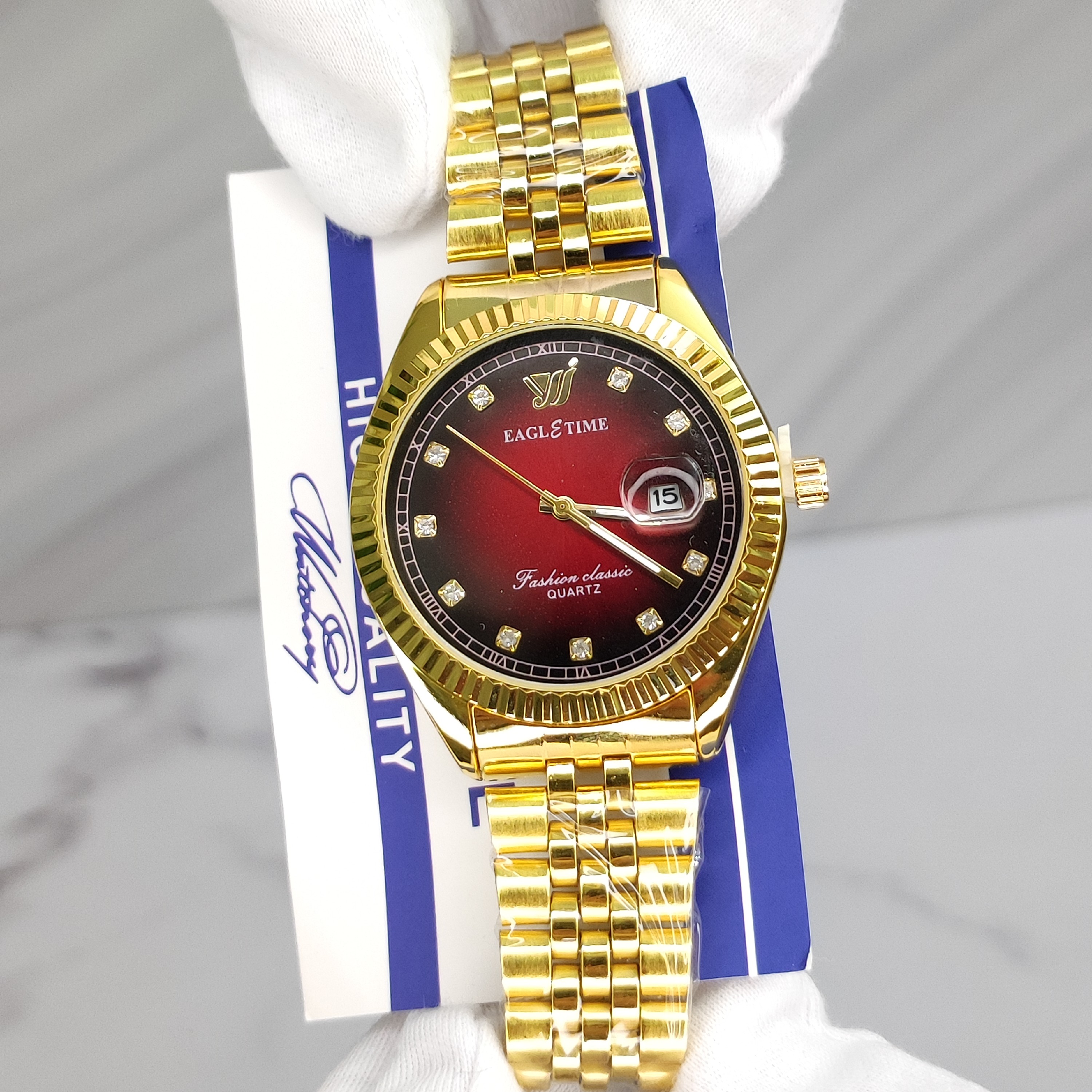 ساعت مردانه اورجینال کیفیت عالی برند EAGLE TIME با کارت اصالت برند طلایی صفحه شرابی